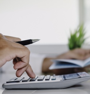 Man using a calculator